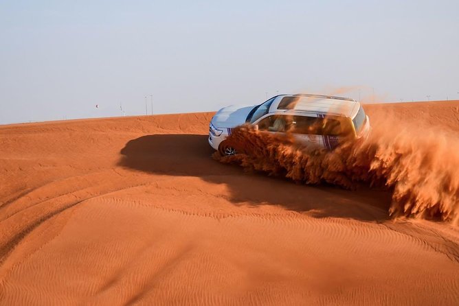 6-Hour Dubai Desert Safari with BBQ Dinner & Quad Biking - Sunset, photographs, and a traditional camp