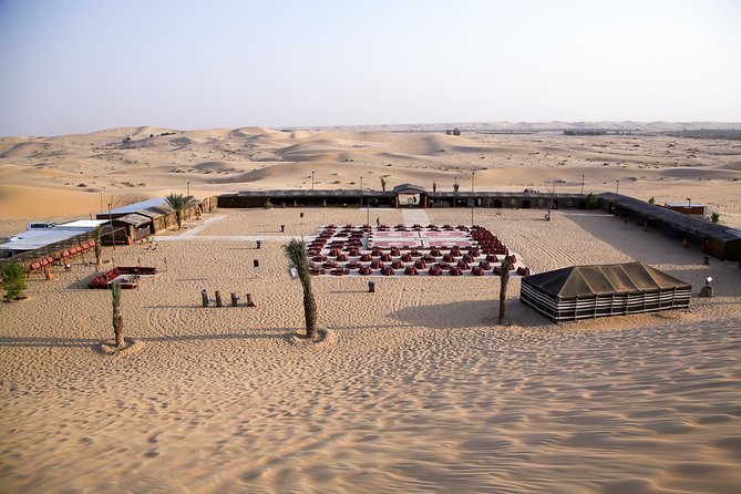 Abu Dhabi Desert Safari (Dune Bashing, BBQ Dinner, Camel Ride & Sand Skii) - Sandboarding on the dunes