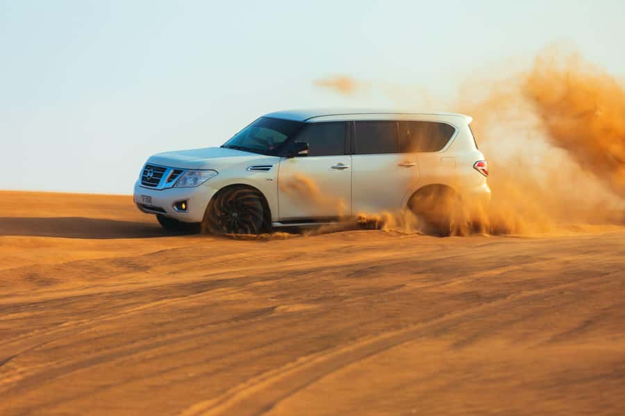 Abu Dhabi: Desert Safari, Quad Bike, Camels & Sandboarding - Arriving at the camel farm