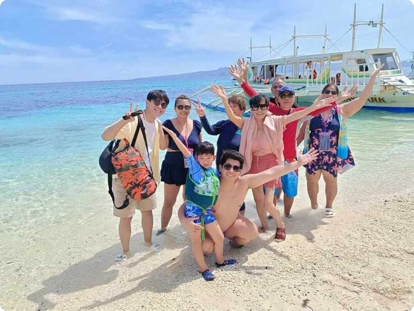 Boracay: Parasailing, Island Hopping, ATV Ride and Kawa Bath - Parasailing above Boracay’s white sand