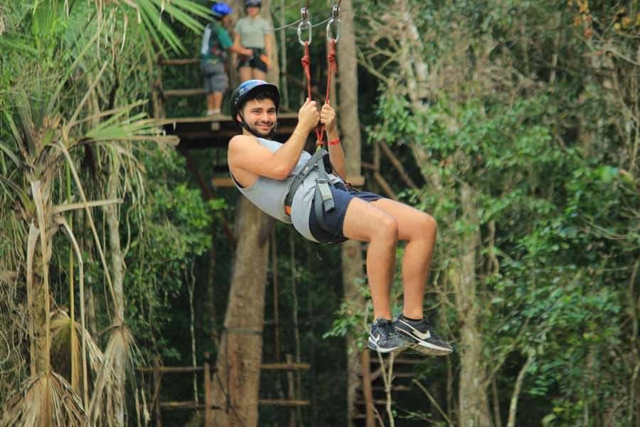 Cancún: ATV, Zipline, and Cenote Adventure with Lunch - Zipping above the trees