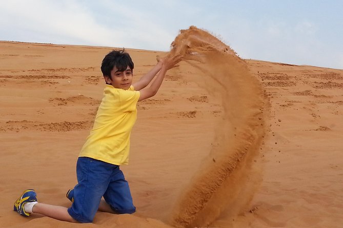 Desert Safari Tour, Quad Bike with BBQ Dinner & Show from Dubai - Dune bashing across the golden dunes