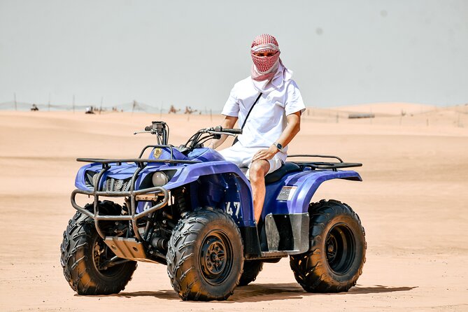 Desert Safari With BBQ Dinner, Quad Bike & Camel Ride from Dubai - Camel riding, falcons, tea, and Arabic welcome