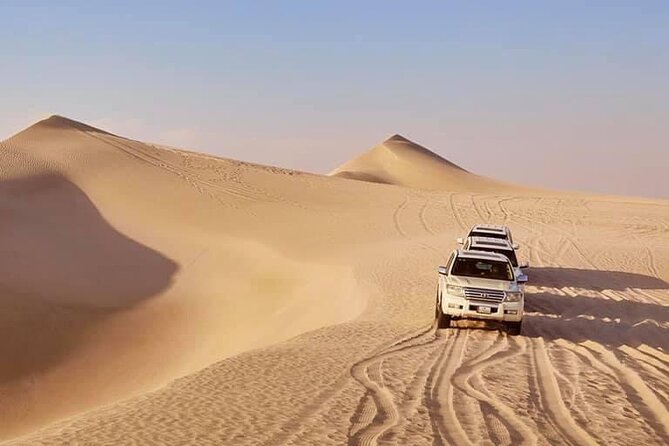 Doha: Desert Safari | Camel ride | Sand-boarding | Quad Biking - Leaving Doha in an air-conditioned 4x4