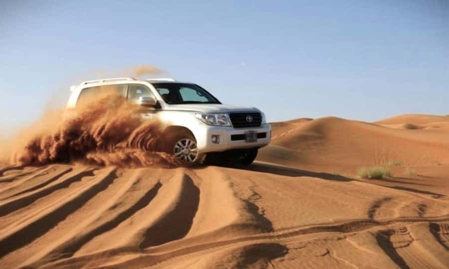 Doha: Desert Safari Dune Bashing, Sandboarding, & Camel Ride - From Doha streets to the southern desert