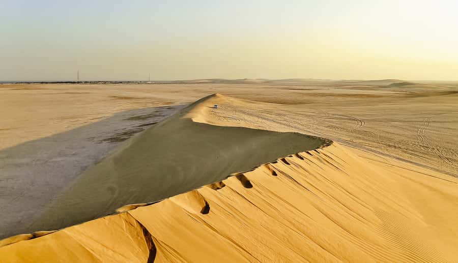 Doha: Desert Safari Dune Bashing, Sandboarding, & Camel Ride - Dune bashing in a professional 4x4