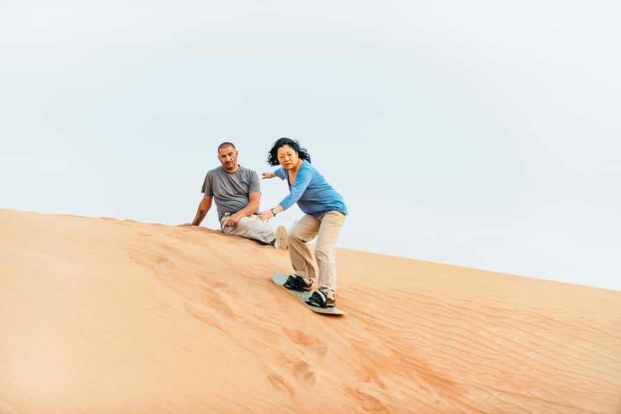 Doha: Desert Safari Dune Bashing, Sandboarding, & Camel Ride - Sandboarding and the high-dune photo stop