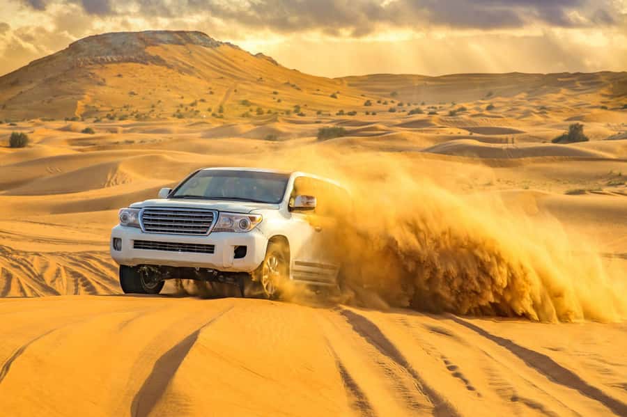 Doha: Desert Safari, Quad Biking, Sand Boarding & Camel Ride - Dune bashing toward the Inland Sea