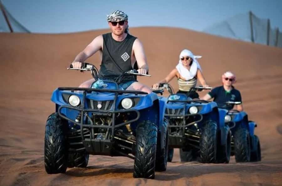 Doha: Desert Safari, Quad Biking, Sand Boarding & Camel Ride - Quad biking on marked desert tracks