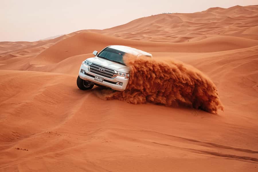 Doha: Desert Safari, Sandboarding, Dune Bashing & Inland Sea - Dune bashing in a Land Cruiser
