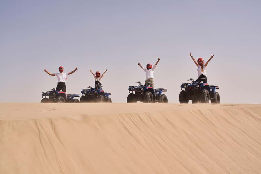 Doha: Desert Safari with Quad Bike, Sandboard & Camel Ride - Sandboarding on Qatar’s dunes