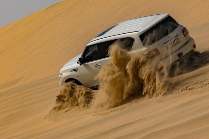Doha Half Day Desert Safari Dune Bashing Camel Ride Sandboarding - Dune bashing across Qatar’s sand