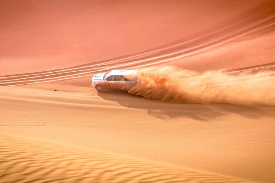 Doha: Safari, ATV, Camels, Sandboarding and Inland Sea Tour - A short camel ride at Sealine Beach