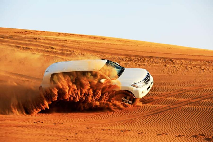 Doha: Sunset Desert Safari, ATV, Camel Ride and Sandboarding - Sandboarding is fun, then the climb begins