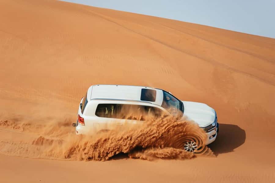 Dubai: Desert Safari, Camel Ride, Sandboarding, Quad Bike - From Dubai hotels to the Red Dunes