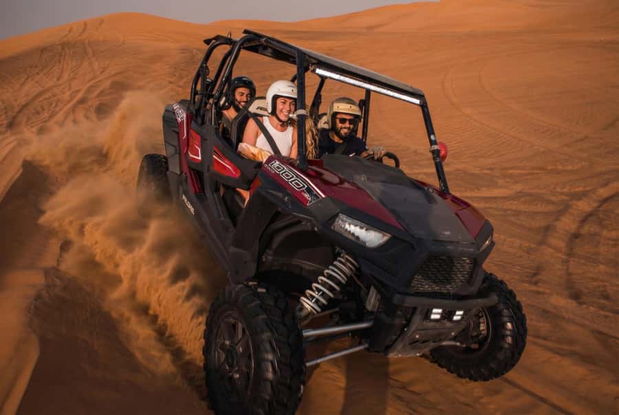Dubai: Desert Safari, Quad Bike, Sandboarding, Camels & BBQ - Hotel pickup and the first desert stop