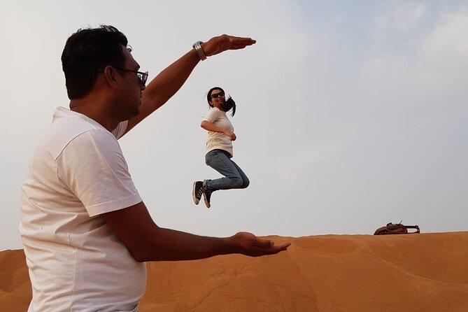 Dubai Desert Safari: Tanoura Show, Dune Bashing and BBQ Dinner - Sandboarding and a short camel ride