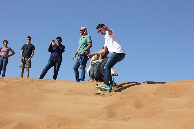 Dubai: Jeep Desert Safari, Camel Ride, and Quad Bike Tour - Sandboarding on a Lahbab dune