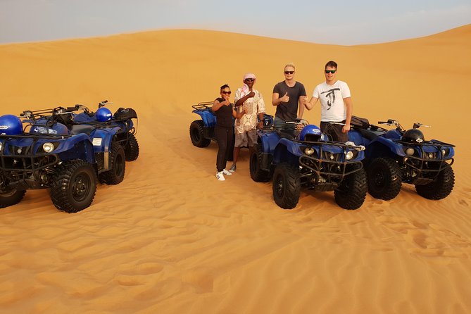 Dubai: Quad Bike Safari, Camels, & Camp with BBQ Dinner - Getting ready for the quad-bike ride