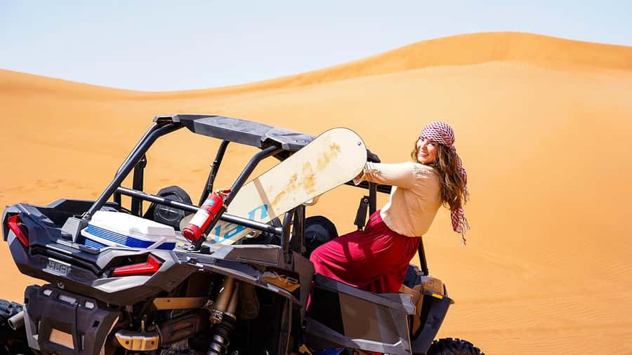 Dubai: Red Dune Desert, Dune Buggy Ride & BBQ Buffet Dinner - Sandboarding, camels, and sunset photographs