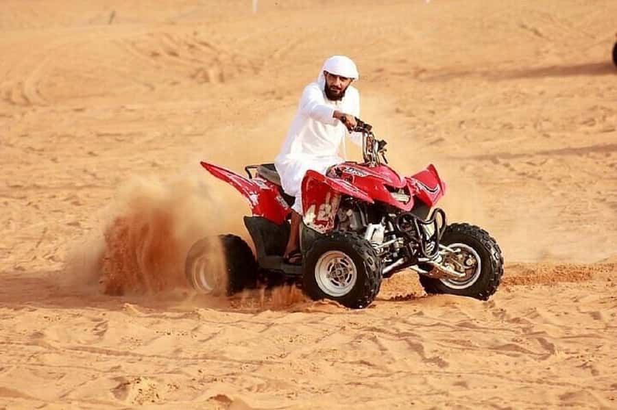 Dubai: Red Dunes Evening Quad Bike, Dune Blast with BBQ - Dune bashing across the red sand