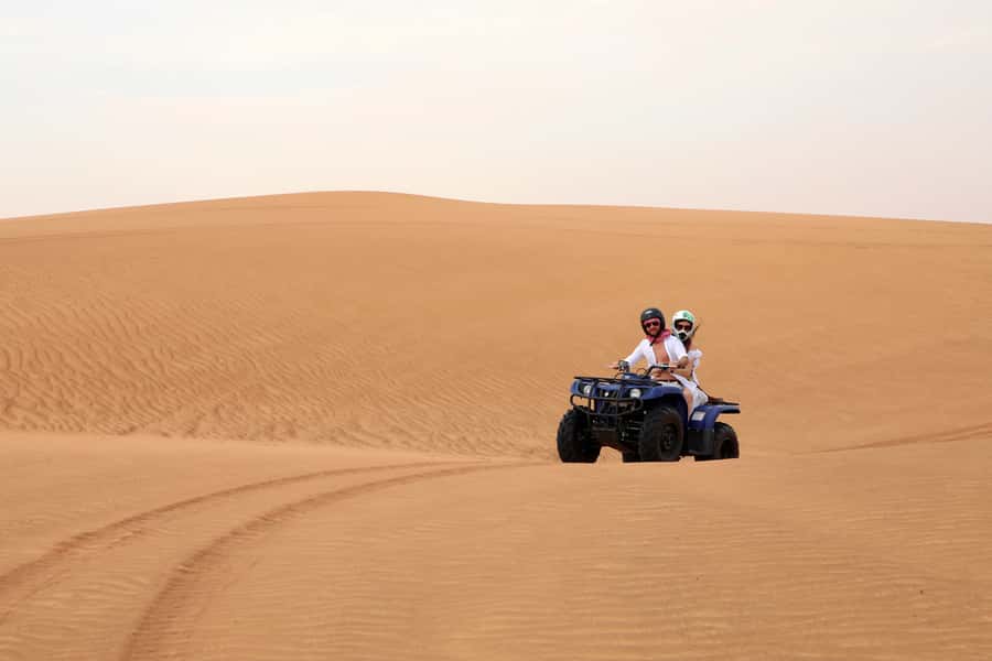 Dubai: Red Dunes Quad Bike with Sandboarding, Camels and BBQ - BBQ dinner with a wide choice of food