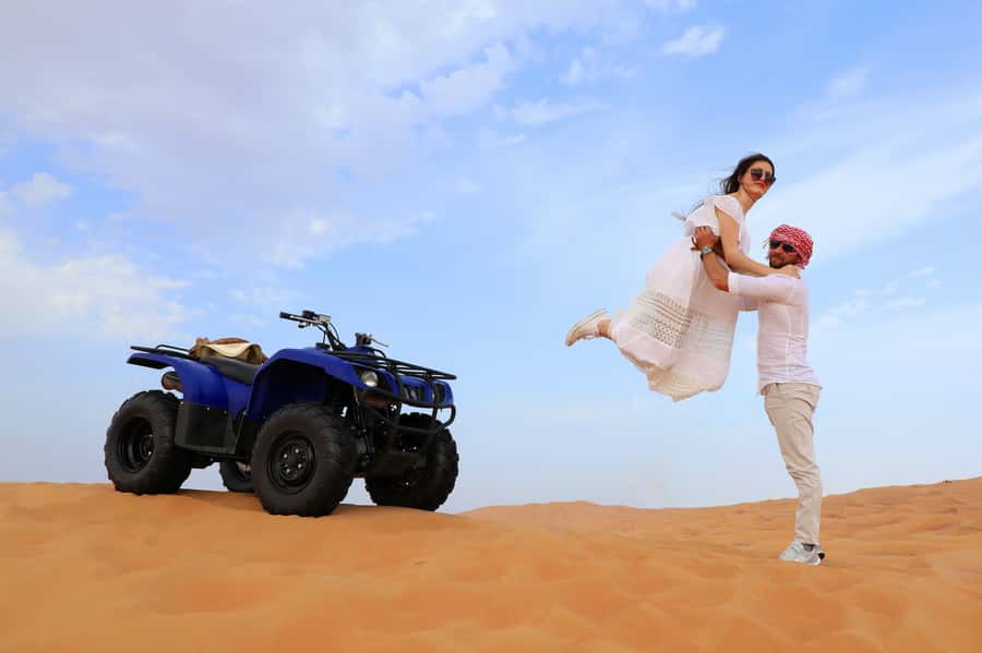 Dubai: Red Dunes Quad Bike with Sandboarding, Camels and BBQ - One hour on the quad bikes