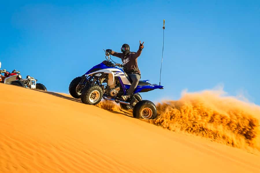 Dubai: Safari, Quad Bike, Camel Ride, and Buffet Dinner - From city pickup to the red dunes