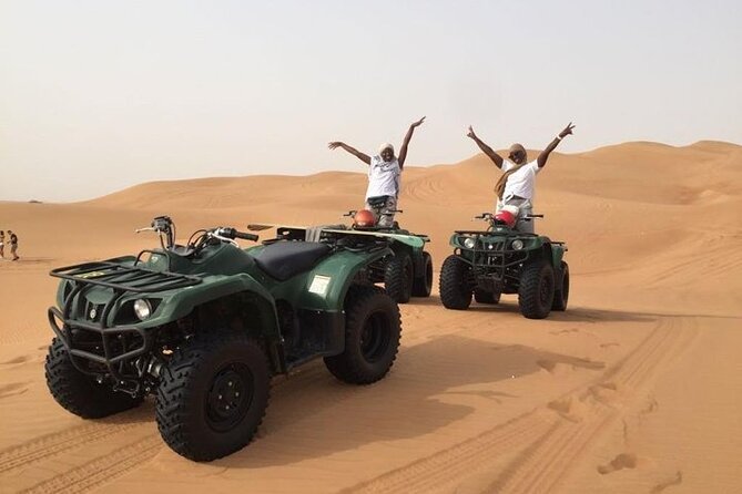 Dubai Self-drive Quad Bike, Sand Boarding, Camels & Refreshments - A short camel ride and Bedouin-style camp