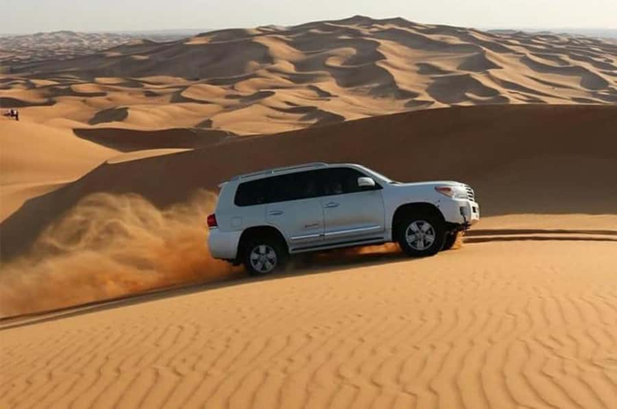 Dune Bashing &Beyond The Ultimate Desert Safari From Doha - Sandboarding on Qatar’s soft slopes