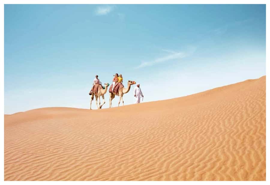 Dune Bashing, Sandboarding, Camel Ride & Optional ATV Ride - Sandboarding with the dunes under your feet