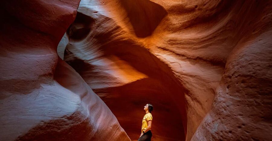 East Zion: Crimson Slot Canyon Exploration and UTV Tour - Walking beneath 100-foot sandstone walls
