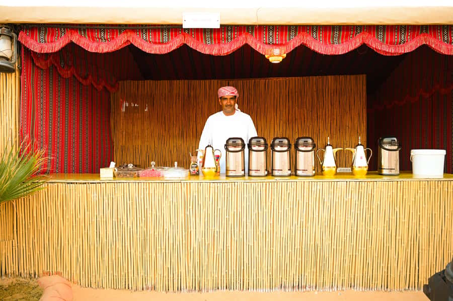From Abu Dhabi: Dune Bashing Desert Safari - Traditional clothes and falcon photos make easy souvenirs