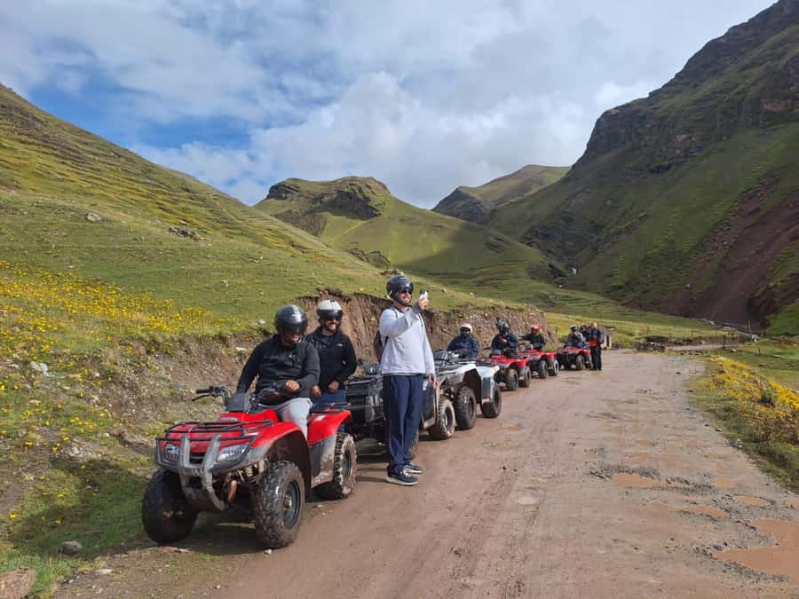 From cusco: Rainbow Mountain ATV Tour with meals - Riding beneath Ausangate toward Rainbow Mountain
