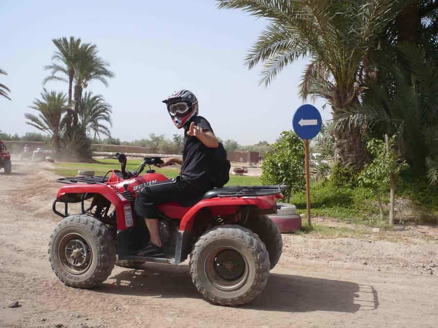 From Marrakech: Adventure Quad Ride in La Palmeraie - Guide style and group experience