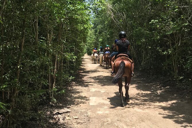 Horseback Riding plus ATV, Cenote, Ziplines, and Lunch - Cooling off in a Mayan cenote