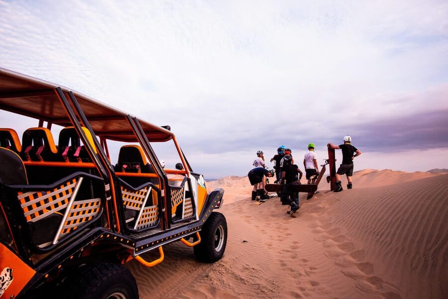Huacachina: Dune Buggy & Sandboard | Huacachina Oasis | Ica - Sandboarding with the included equipment