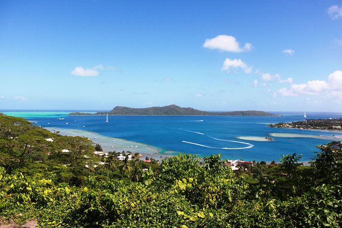 Island Tour & Getaway on the Bora Bora Mountains by Quad / ATV - A family stop with fruit and coconut bread