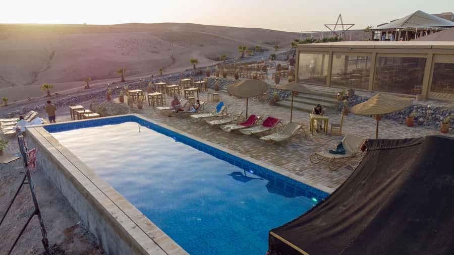 Marrakech: Agafay Desert Quad, Camel or Pool Day with Lunch - The show is cheerful, busy, and designed for participation