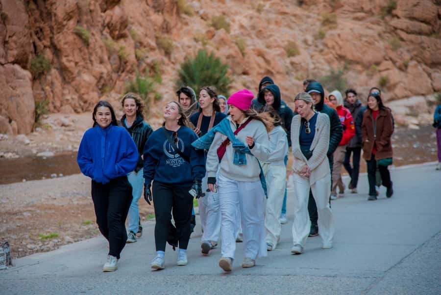 Marrakech to Fes: 3-Day Merzouga Desert Camel & Sandboarding - Walking beneath the cliffs of Todra Gorge