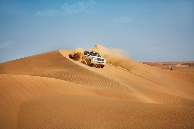 Morning Desert Safari with Quad Bike Tour Abu Dhabi - Dune bashing in a 4x4