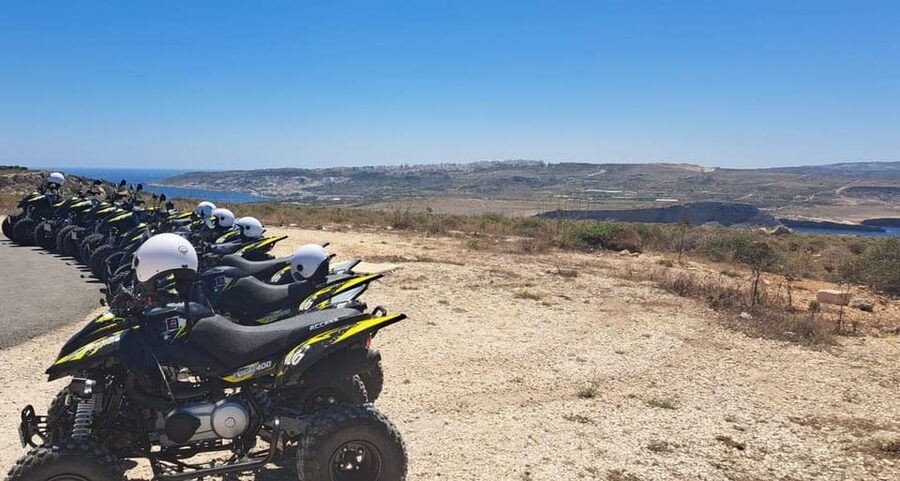 North Malta: Quad Bike Tour with Scenic Land, Sea & Swimming - Mellieha village closes the loop