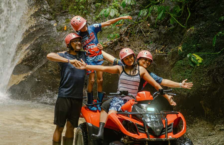 Quad Bike Bali With Tunnel & Waterfall Tour - Water, mud, and the large waterfall
