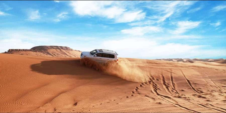 Quad Bike/Buggy, Desert Safari, Camel Ride, Dune Bashing - Sandboarding that suits beginners