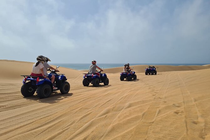 Quad to the Sand Dunes and Wild Beach - Getting fitted with a helmet, glasses, and charlotte