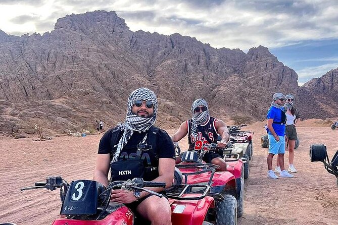 Safari 5 in 1 Quads, Camels, Show, Dinner & Star Gazing in Sharm El Sheikh - Quad biking on a dirt road, not across dunes