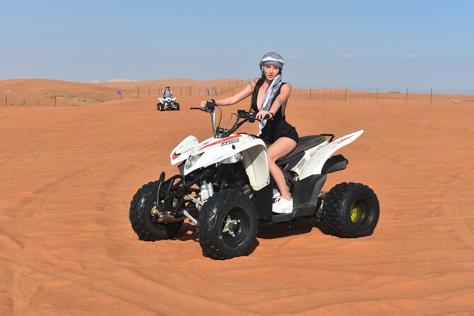 Sunset Desert Safari Quad bike Camel ride Sand Board & BBQ Dinner - Dune bashing and sandboarding at sunset